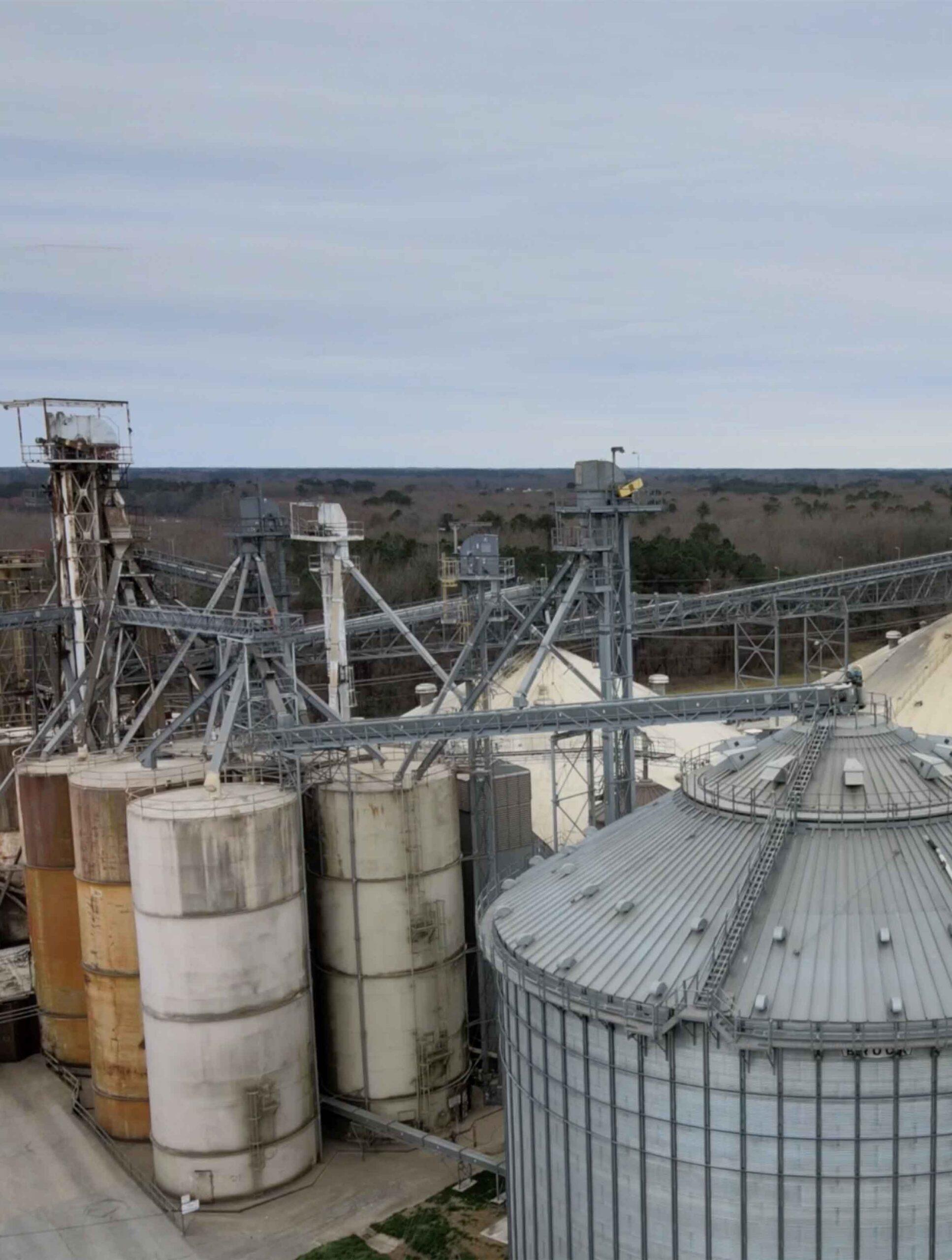 Close up of industrial silos and grain elevator.